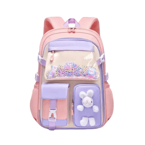 Ein rosa-lila Schulrucksack mit mehreren Taschen, durchsichtigen Einsätzen, bunten Perlen und einem kleinen weißen Plüschhasen – perfekt für die Einschulung jedes Mädchens.